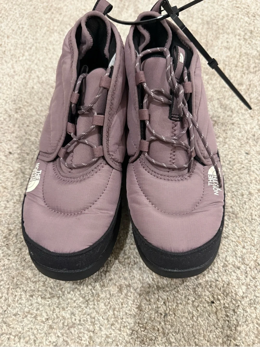 The North Face Mauve Slip-On Winter Boots with Black Outsole and Bungee Lacing